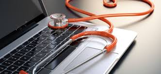 Open laptop with an orange stethoscope laying on it